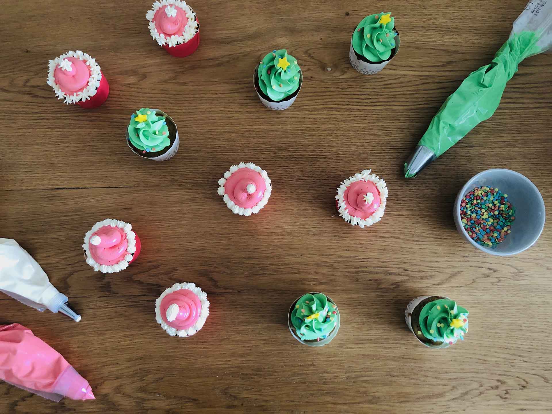 Christmas_Cupcakes_All_With_Piping_Bags_From_Top.jpg