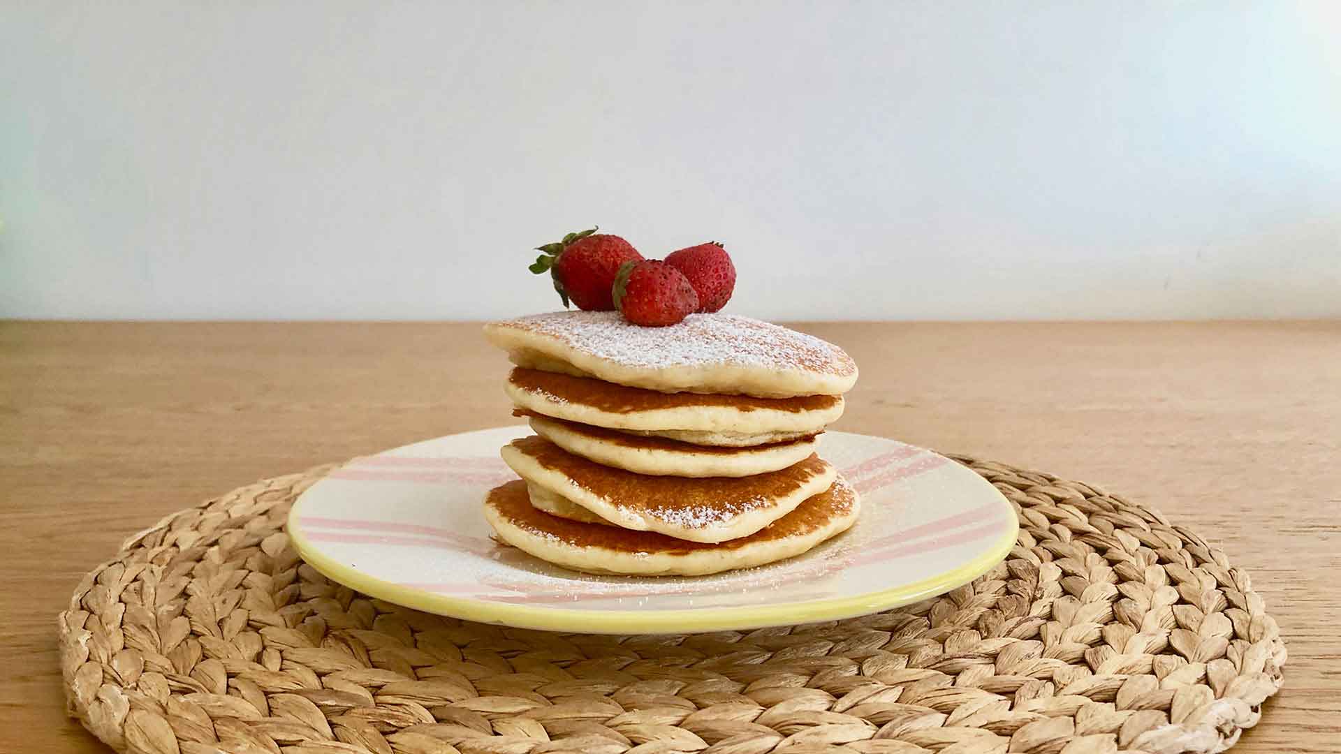 Pancakes_Stacked_Pancakes_With_Strawberries_And_Poweder_Sugar_1920_1080.jpg